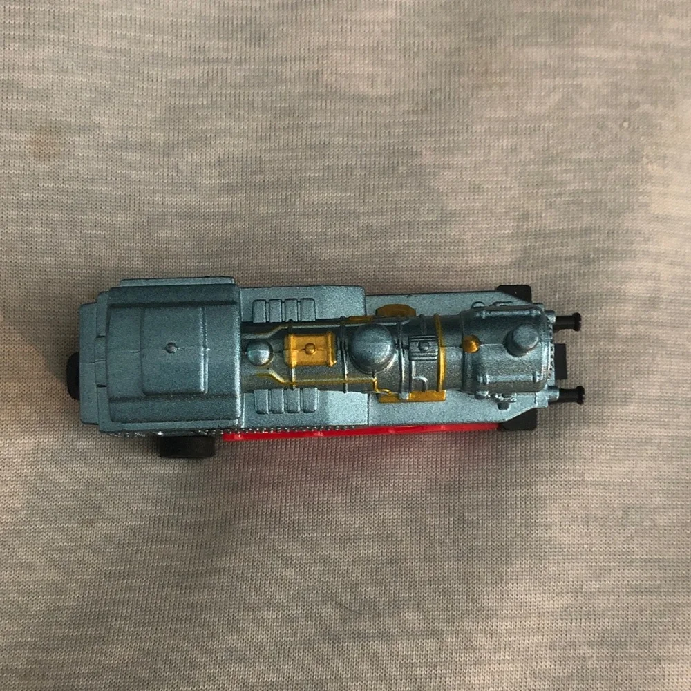 Blue and Red Toy Train with Gold Accents